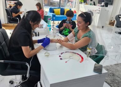 Smiling bride-to-be wearing a sash and enjoying her special day of pampering during her hen party at Seema’s Beauty Salon